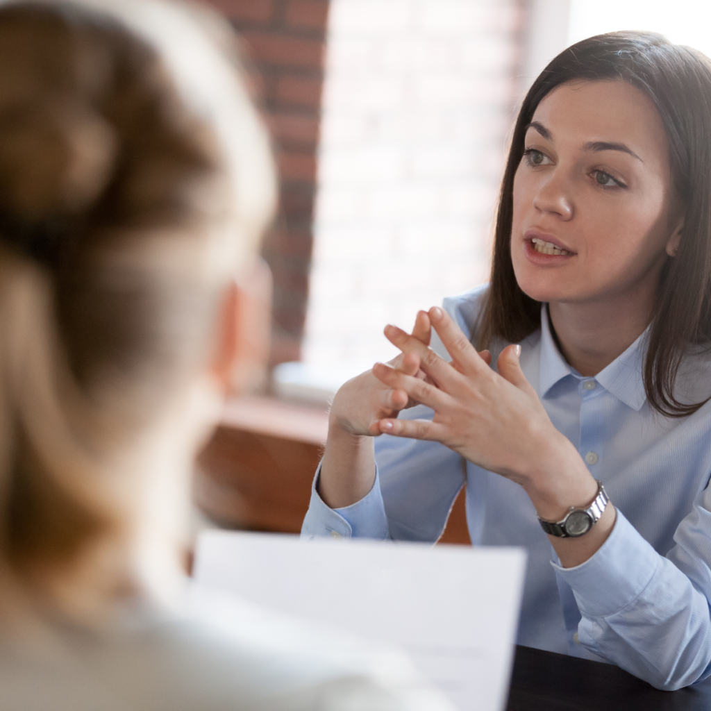 Security staff discussing automated compliance solutions during a candid office meeting.