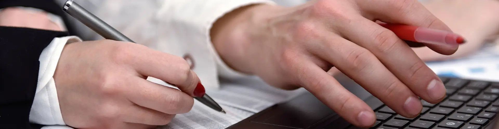 Compliance professionals reviewing an audit roadmap on a laptop with clarity and confidence