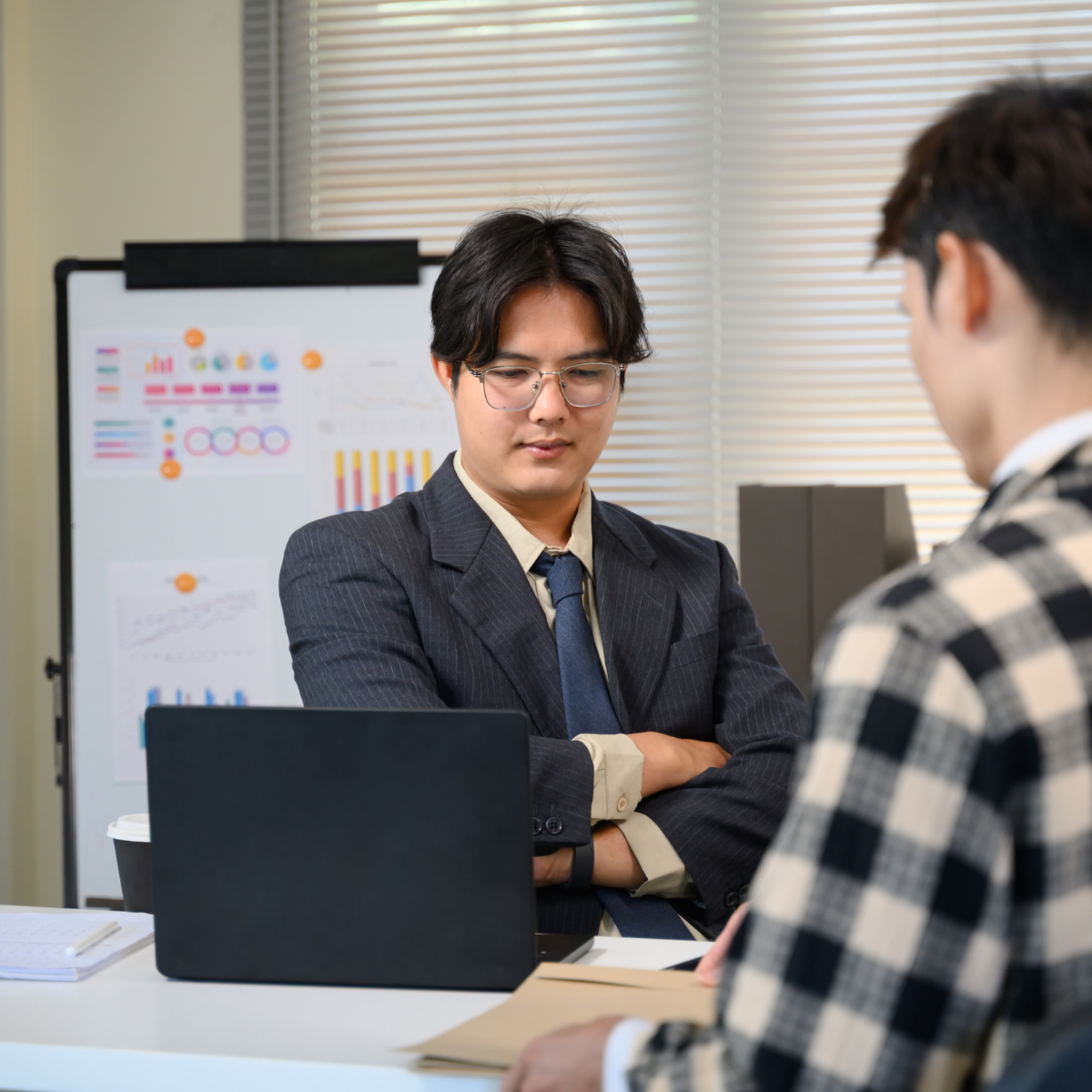 Compliance professionals scaling a custom audit framework on a laptop to fit business growth